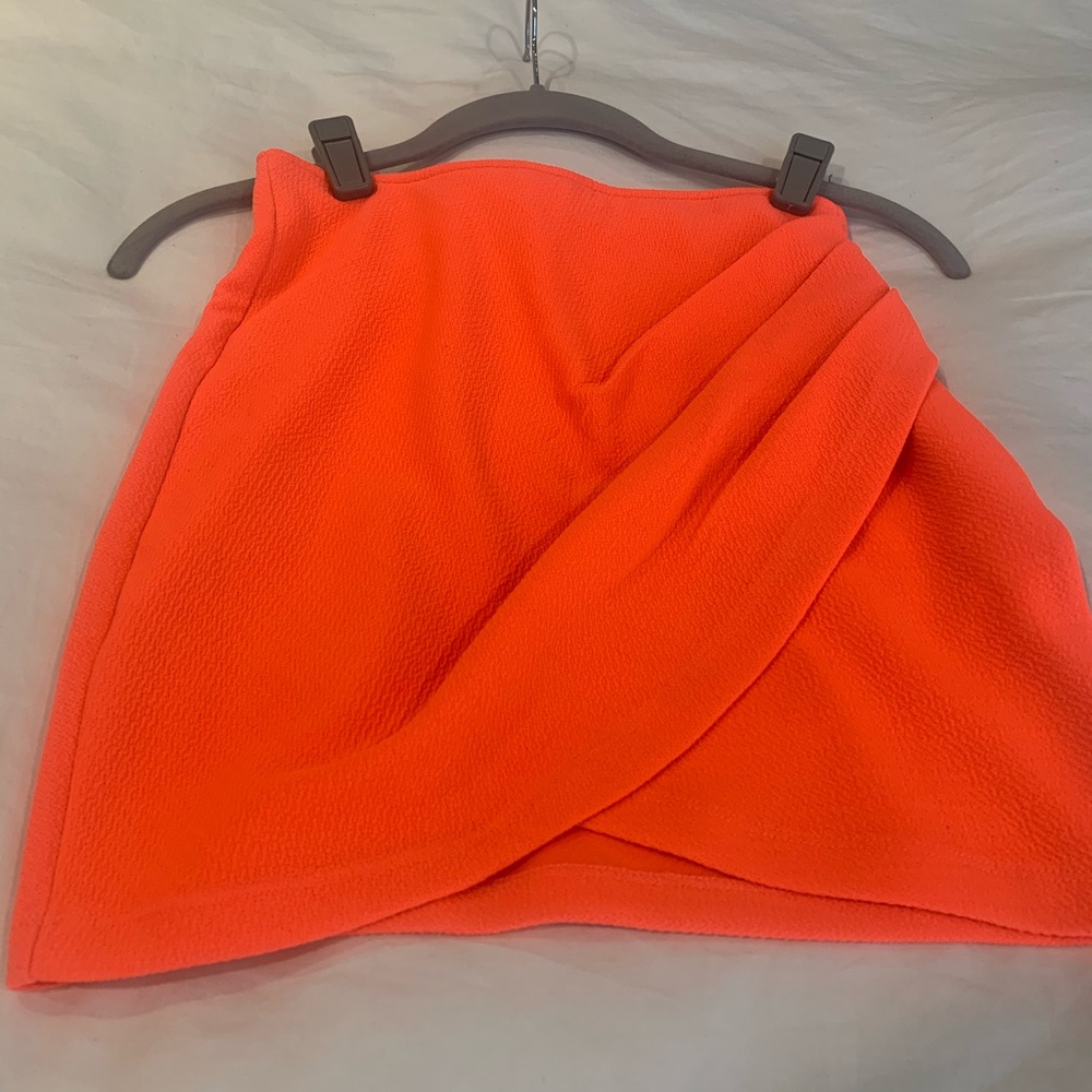 Bright orange mini skirt